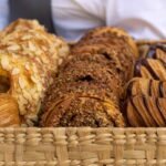Close-up view of a basket filled with assorted French pastries, perfect for bakery lovers.